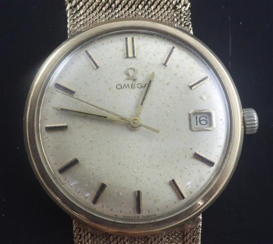 A gentlemans 1960s 9ct gold Omega manual wind wrist watch, gross weight 54.7 grams.